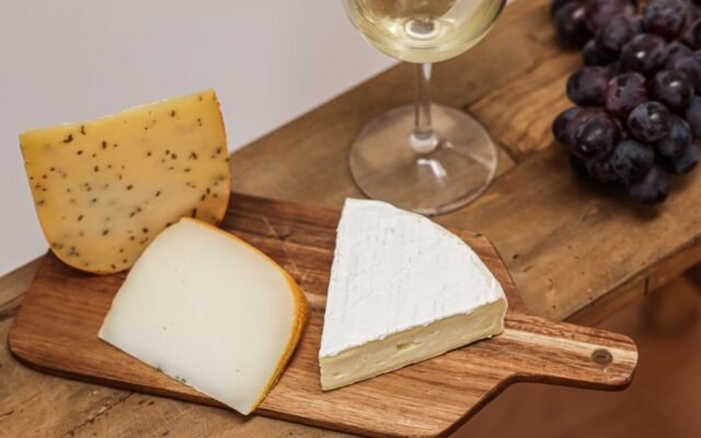 A cheese board with assorted cheeses