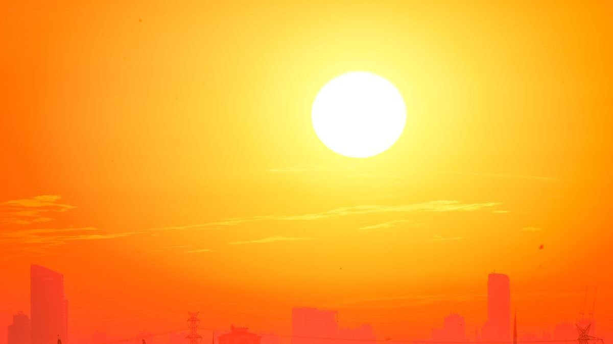 A city skyline silhouetted against a vivid