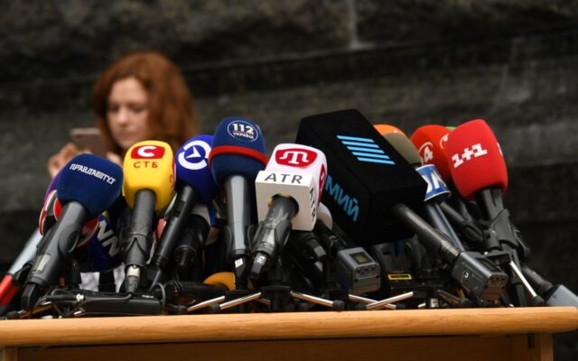 Various microphones setup at a press conference
